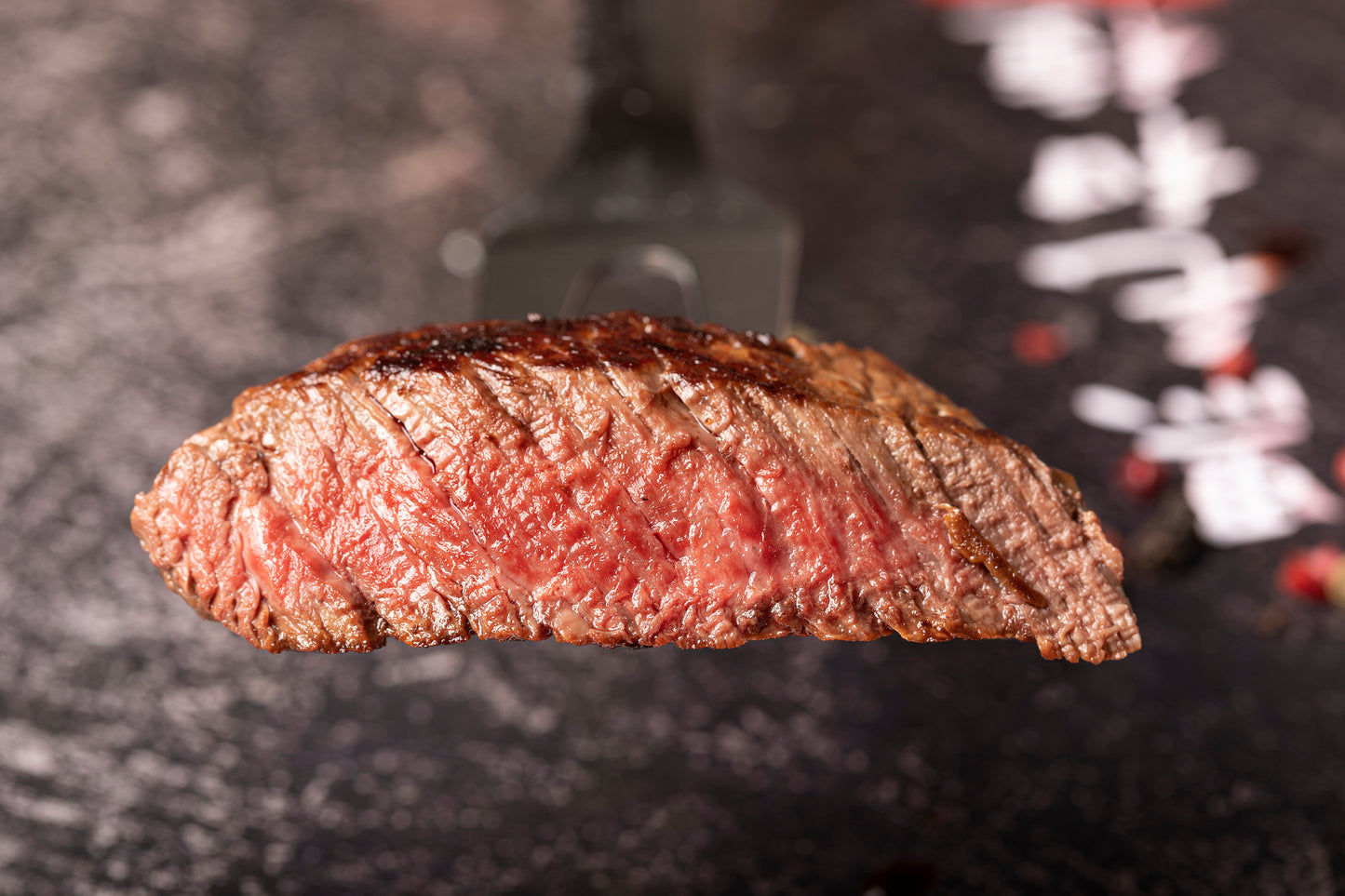 Cross-section of Wagyu Steak sirloin medium cooked suspended in air